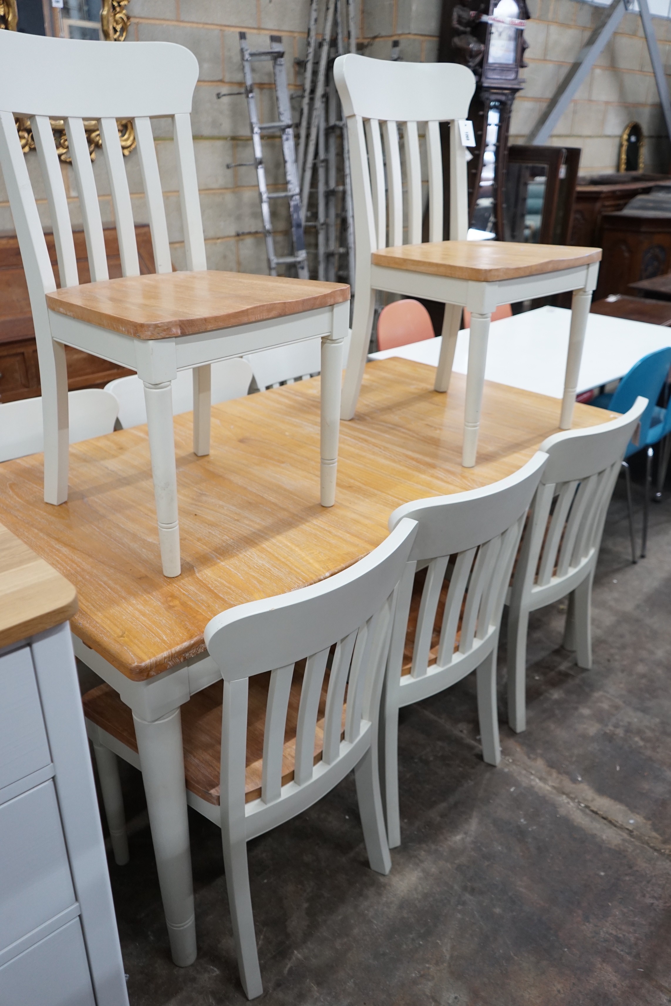 A modern John Lewis part painted extending dining table and eight matching chairs, table width 209cms extended, depth 90cm, height 78cms.